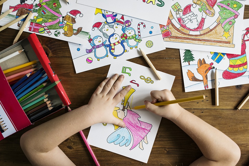Top down table view of kid colouring Kid colouring