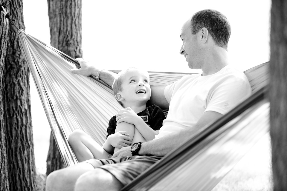 Father and son on a swing Father and son on a swing