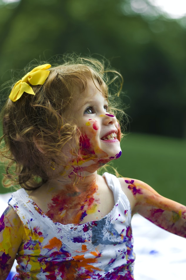 Girl with paint on her face and body Girl with paint on her face and body