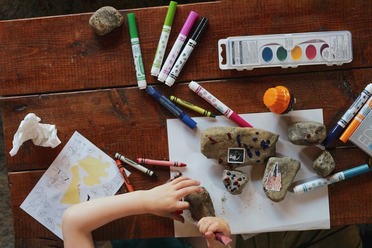 Top down table view of kids crafting Top down table view of kids crafting