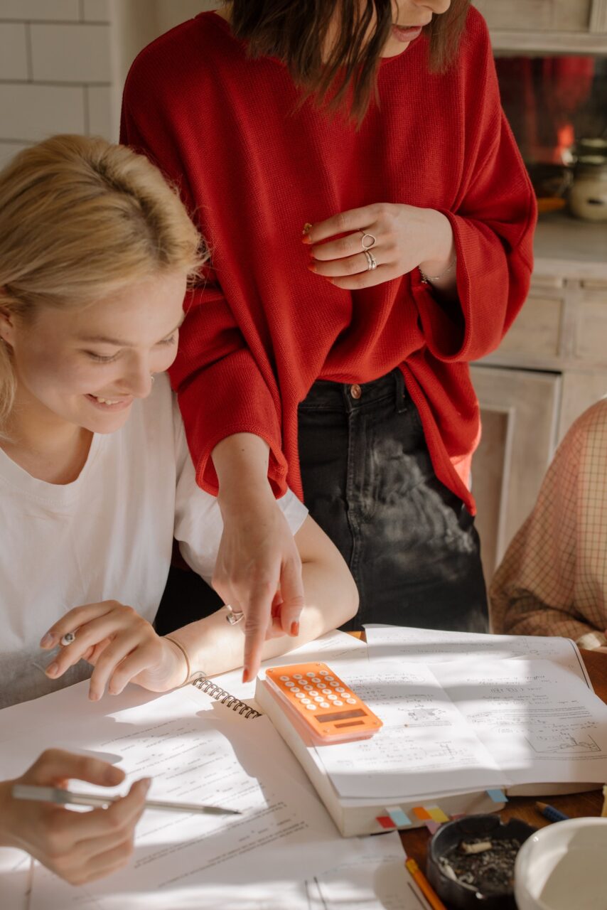 A teacher giving feedback to students