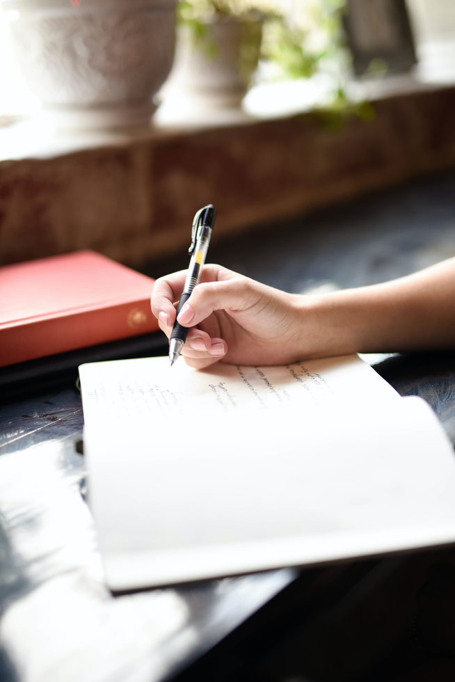 writing ideas in a notebook