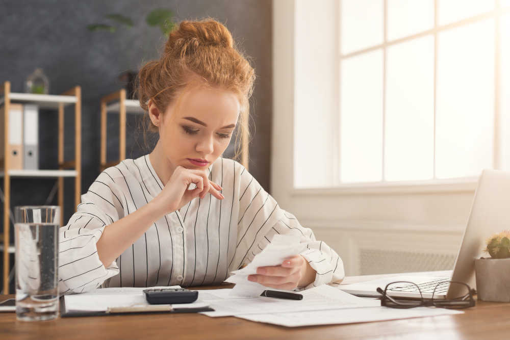 Student watching spending tallying receipts