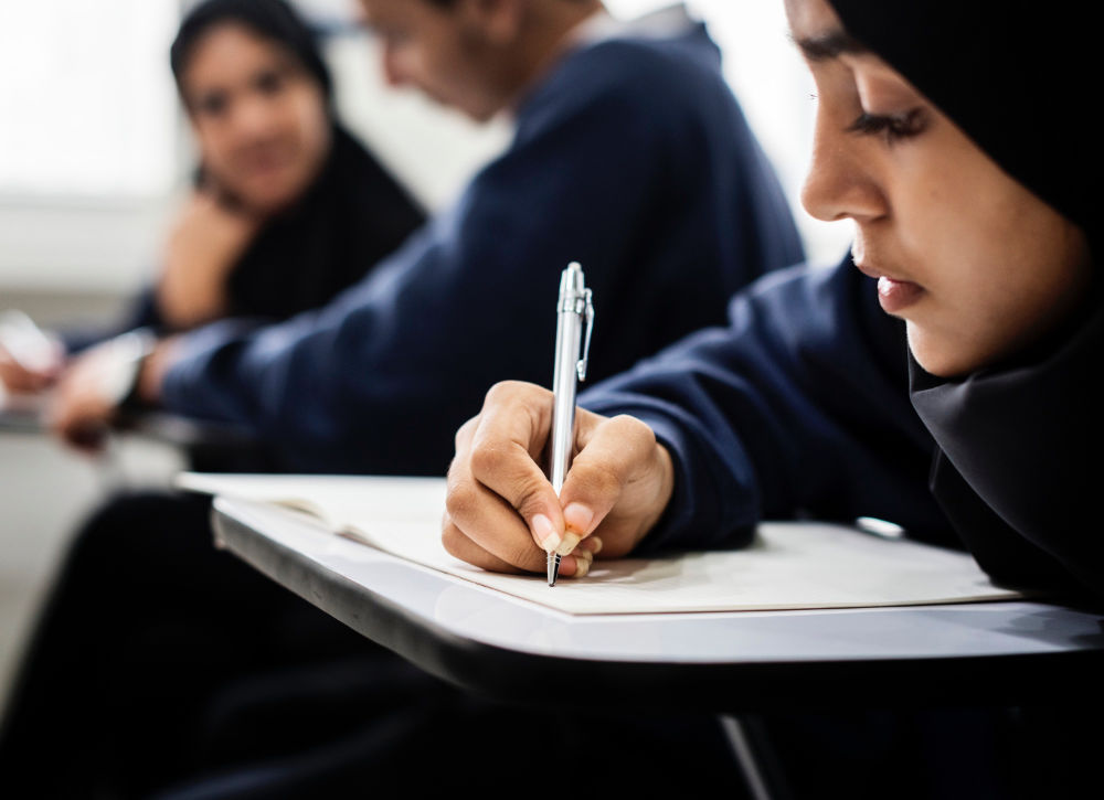 28824 Girl in Uniform Doing Exam 1000