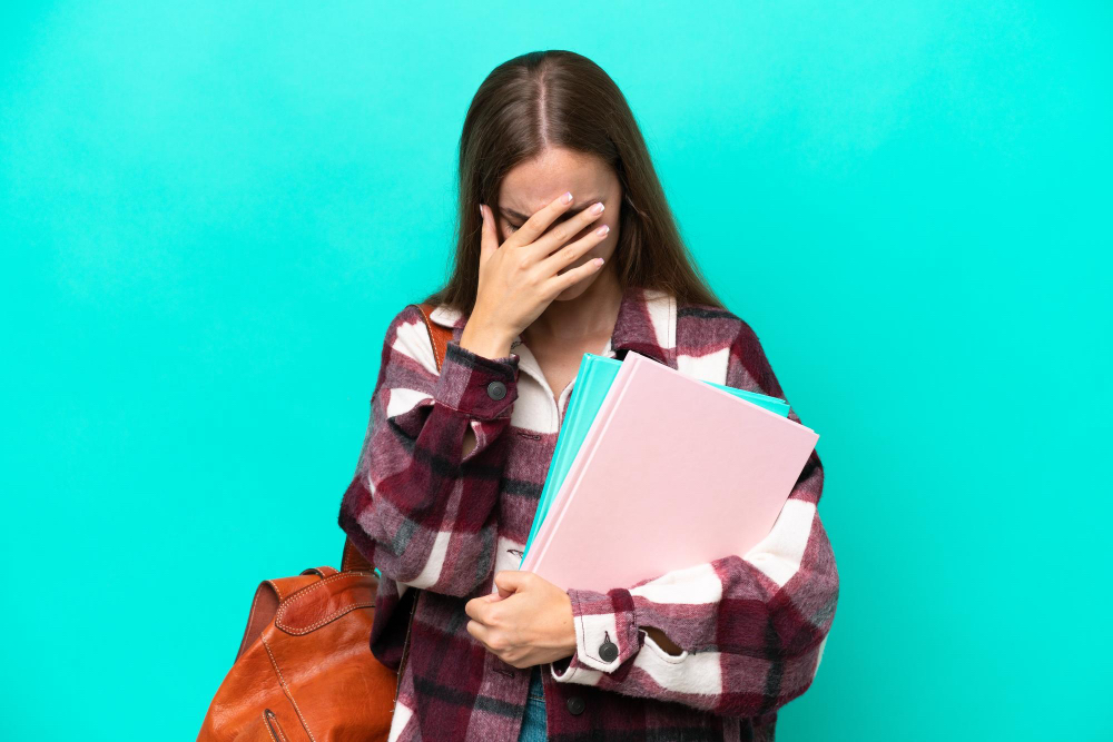 438396 girl with books backpack facepalm